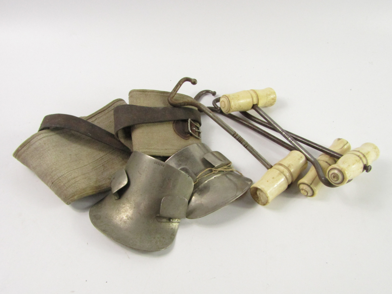 Appraisal: Four thC boot pulls with turned bone handles gaiters and