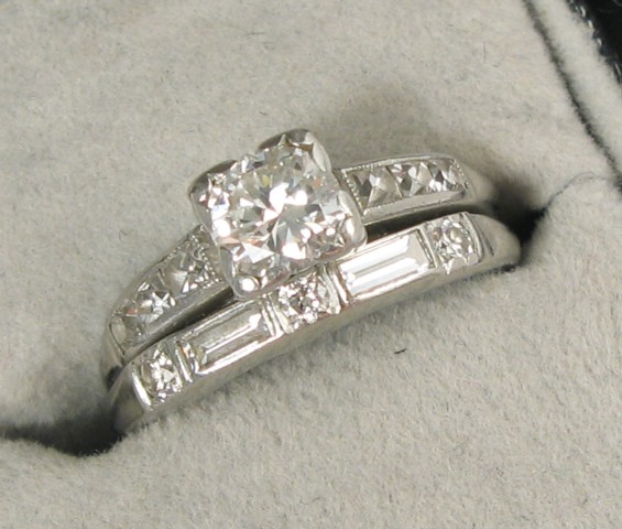 Appraisal: DIAMOND AND PLATINUM RING centering a round brilliant-cut diamond weighing