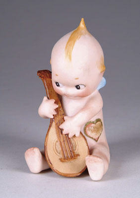 Appraisal: SEATED KEWPIE WITH MANDOLIN A large Kewpie with original paper