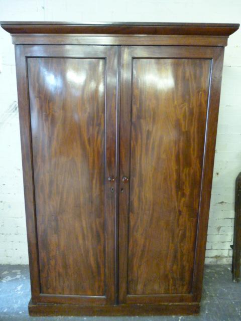 Appraisal: AN EARLY VICTORIAN MAHOGANY WARDROBE the moulded cornice over two