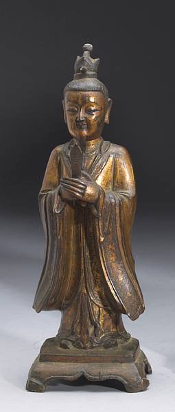 Appraisal: A gilt bronze Daoist divinity Late Ming Dynasty The bearded