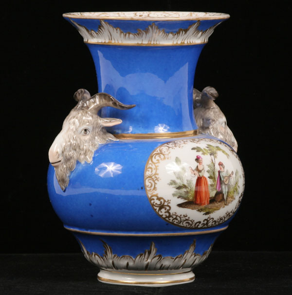 Appraisal: German porcelain vase with ram head handles double sided hand