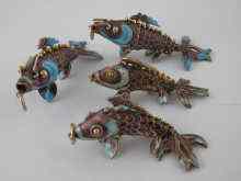 Appraisal: Four articulated white metal tests silver and enamel fish charms