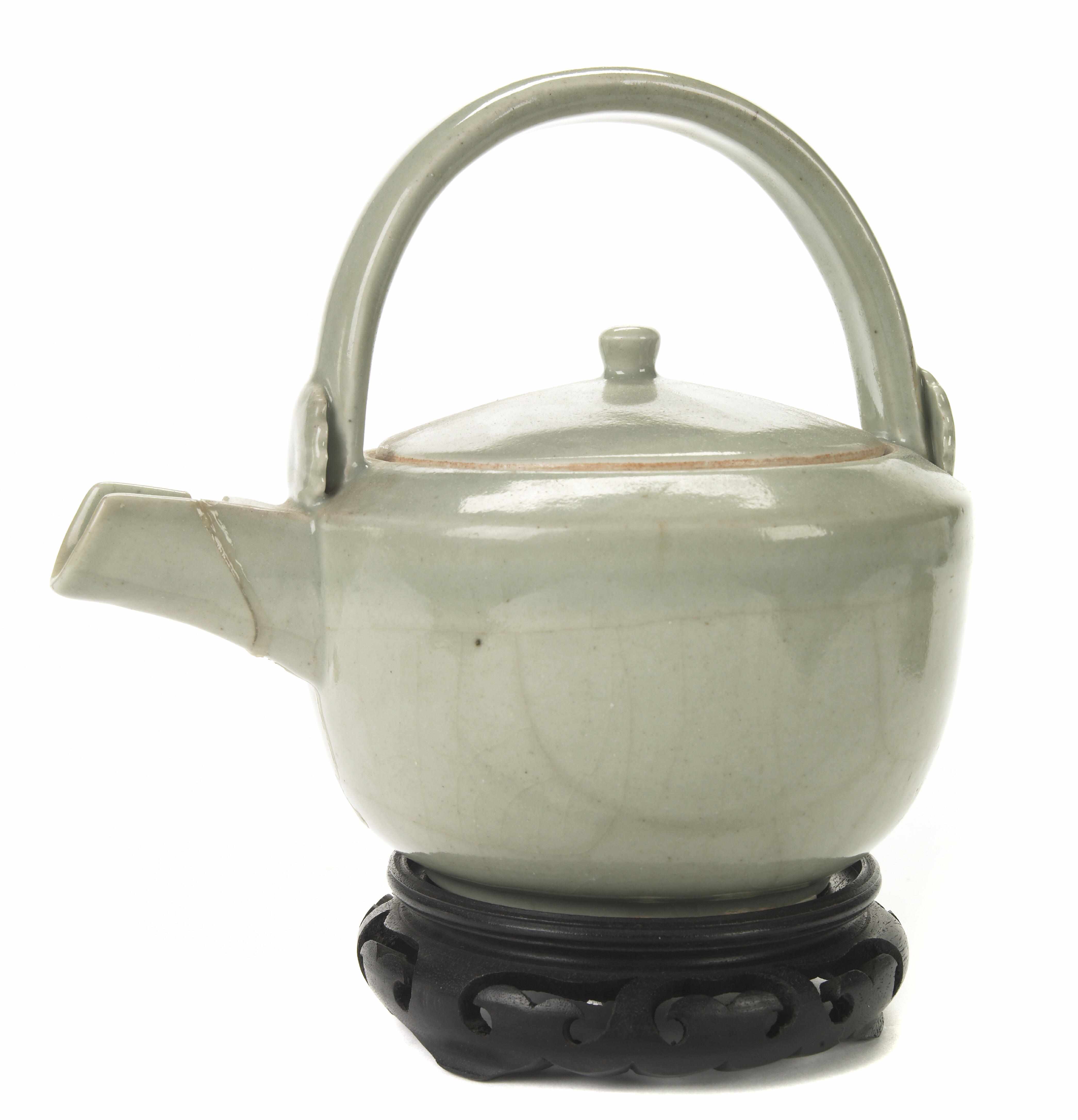 Appraisal: A Chinese pale celadon glazed ceramic teapot restored spout hairline