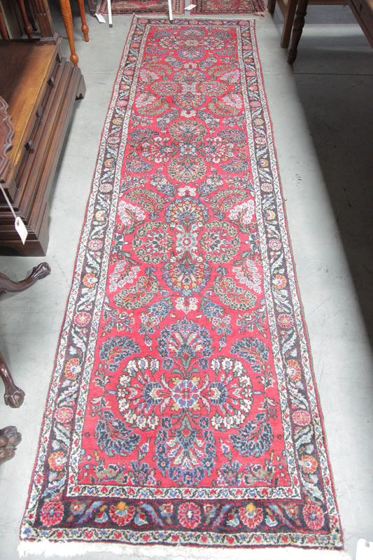 Appraisal: ORIENTAL STYLE RUNNER Red ground having a repeating floral motif