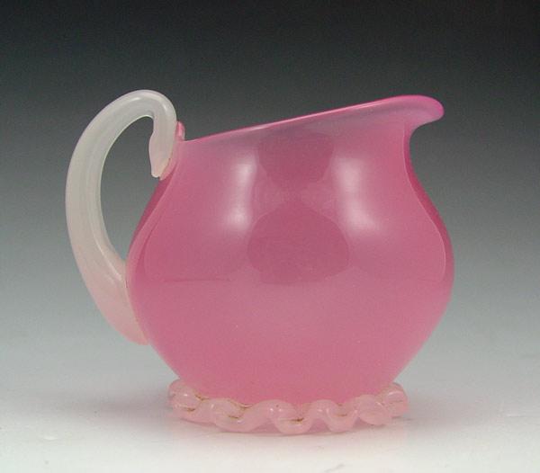 Appraisal: STEUBEN ROSALINE SMALL PITCHER Pink opaline with white applied handle