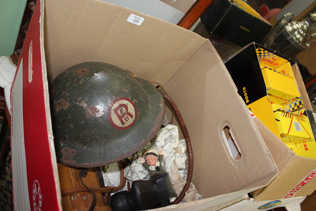 Appraisal: A WORLD WAR II GREEN PAINTED TIN HELMET together with