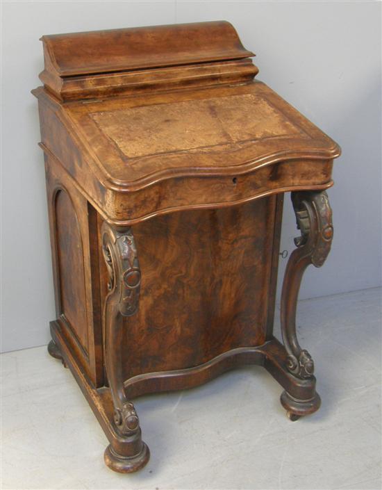 Appraisal: th century walnut serpentine davenport the raised back with fitted