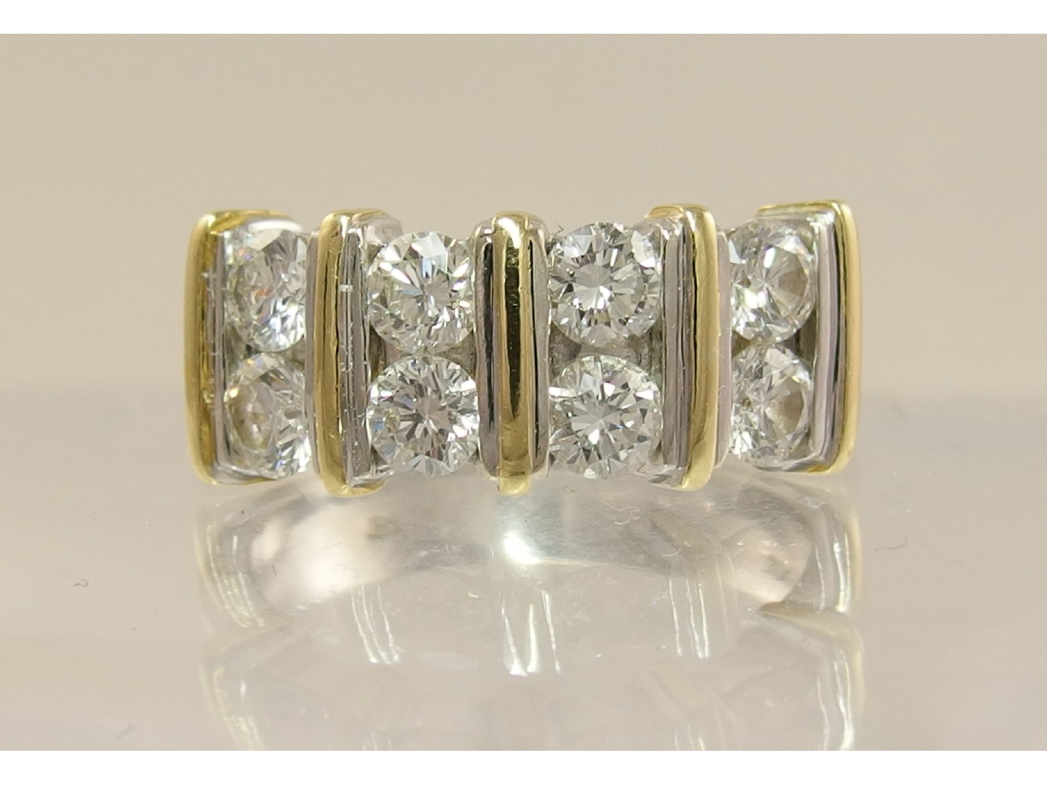 Appraisal: An ct white and yellow gold diamond panel set ringof