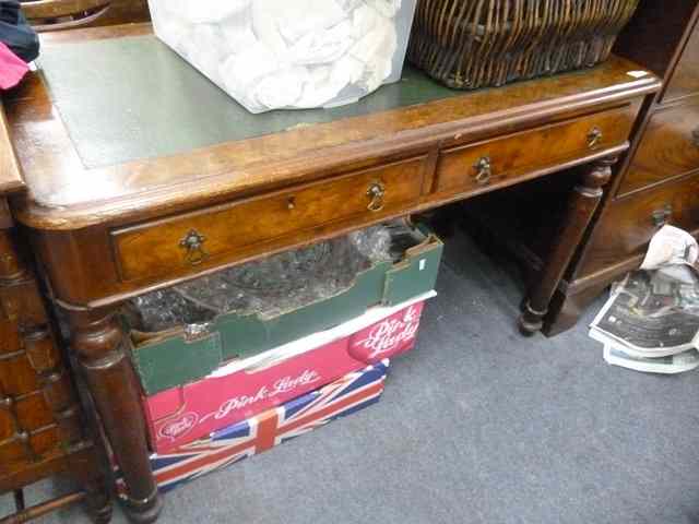 Appraisal: A VICTORIAN WALNUT VENEERED RECTANGULAR WRITING TABLE fitted two drawers