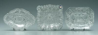 Appraisal: Three Sandwich glass dishes one rectangular with cherubs playing pipes