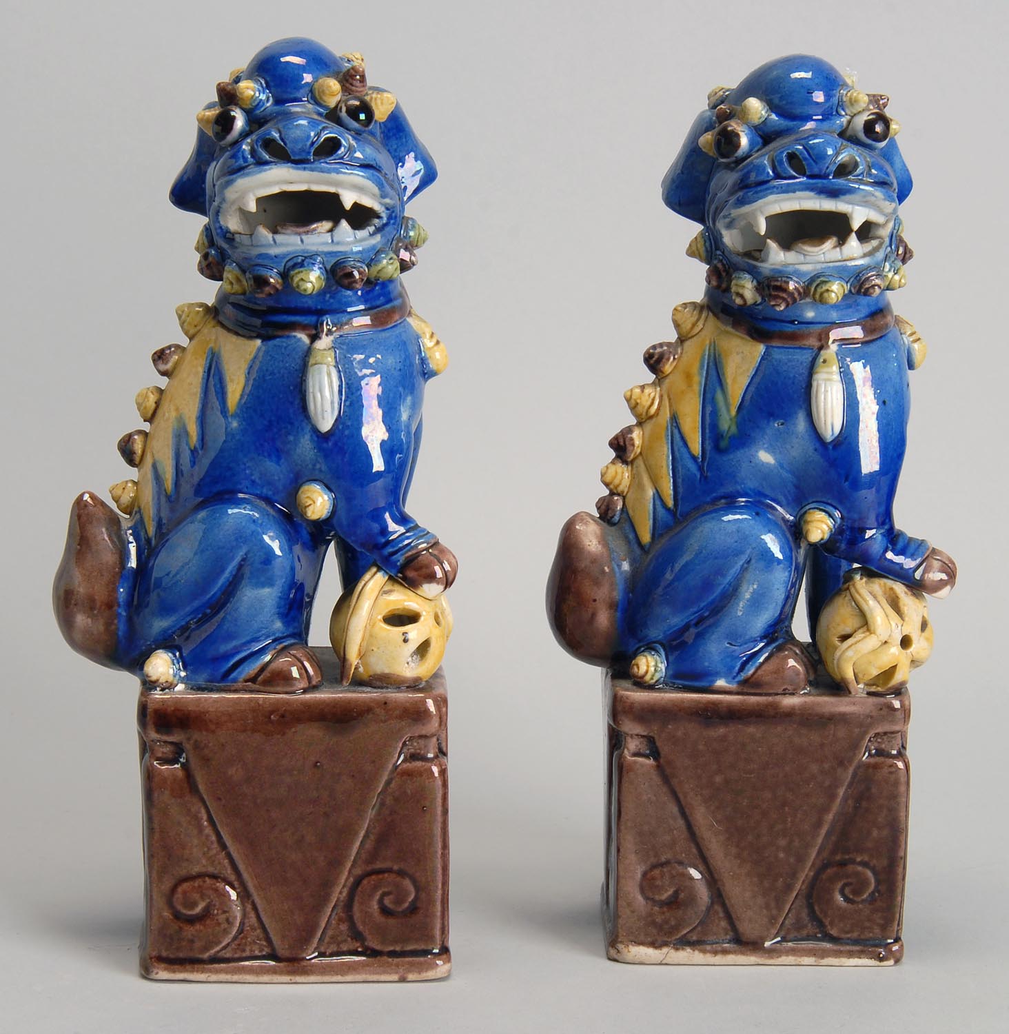 Appraisal: PAIR OF PORCELAIN FU LIONS th CenturyIn seated position with