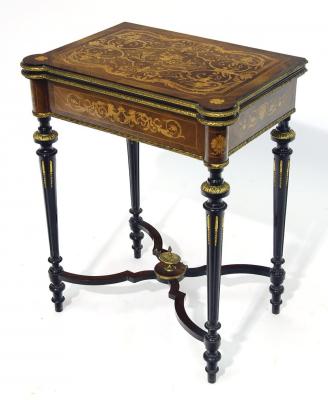 Appraisal: A KINGWOOD AND EBONISED FOLDING CARD TABLE of oblong form