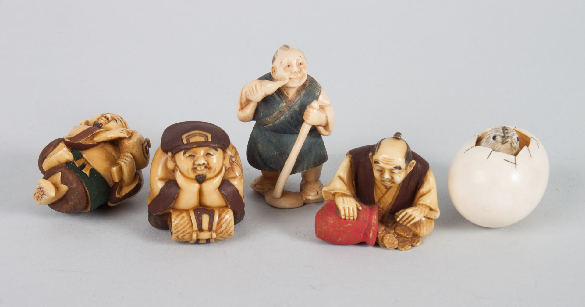 Appraisal: Five Japanese carved ivory netsukes with polychrome and ink highlights