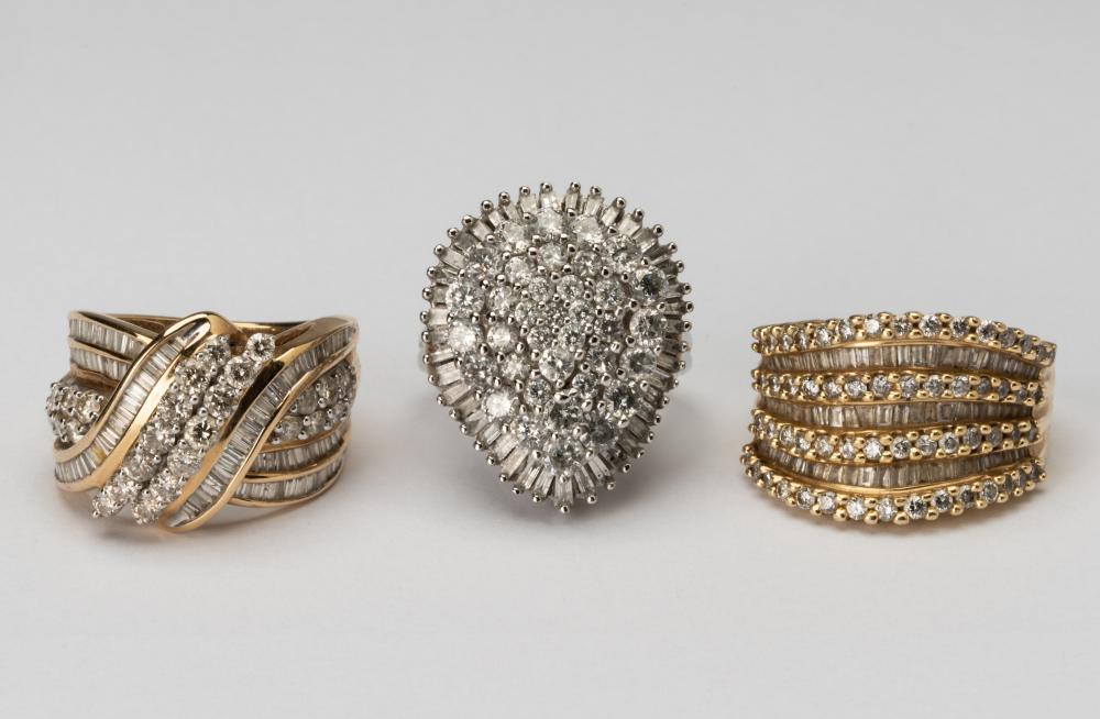 Appraisal: THREE ASSORTED KARAT GOLD DIAMOND RINGSone karat yellow gold diamond