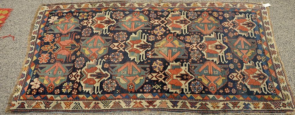 Appraisal: Caucasian Oriental throw rug side and end wear ' x