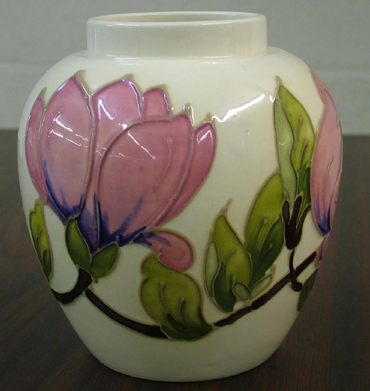 Appraisal: Moorcroft 'Magnolia' ovoid vase decorated on an ivory ground impressed