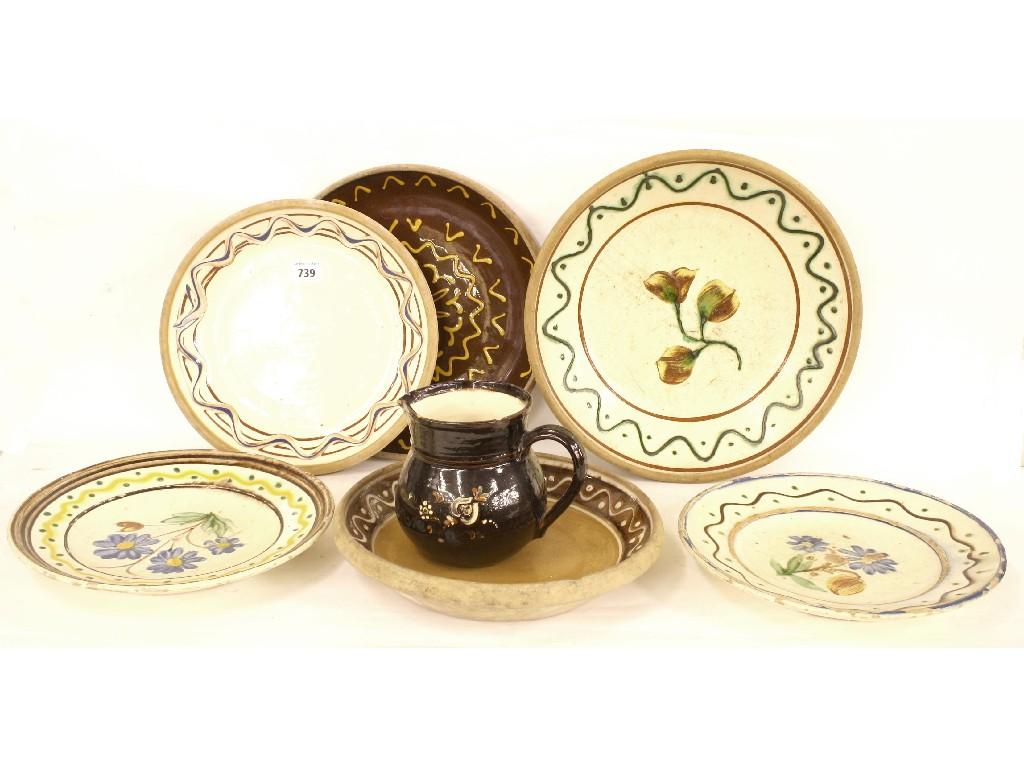 Appraisal: Six various painted slipware circular plates and a baluster jug