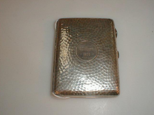 Appraisal: An Edwardian silver card case with green moire lined interior