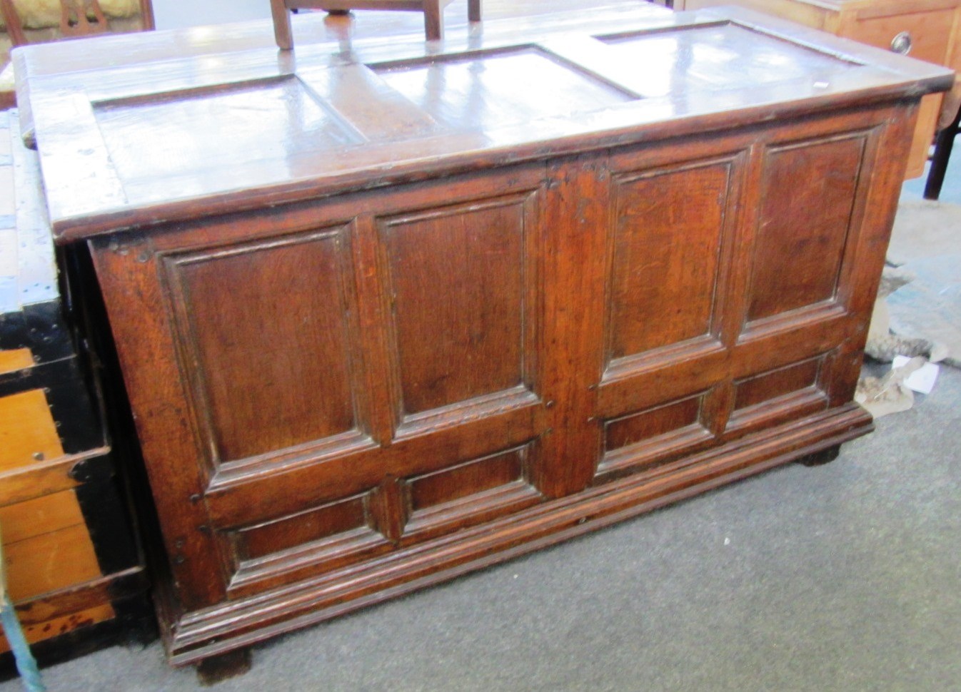 Appraisal: A late th century oak coffer with triple panel top