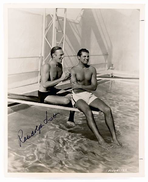 Appraisal: Two Randolph Scott signed black and white photographs s s