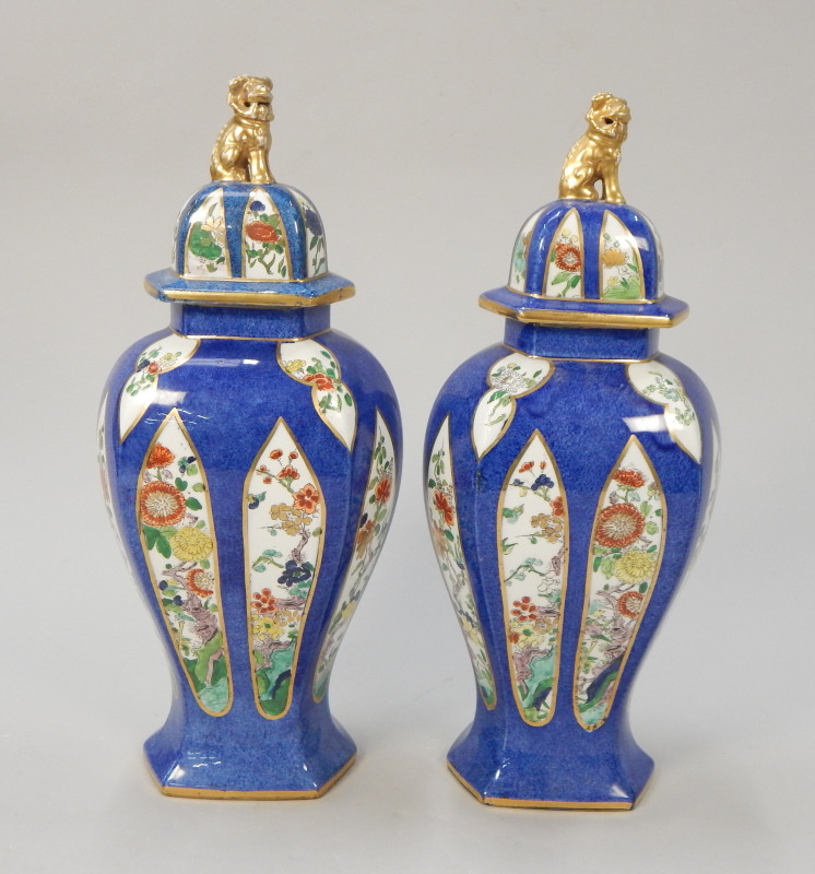 Appraisal: A pair of Phoenix ware pottery vases and covers each