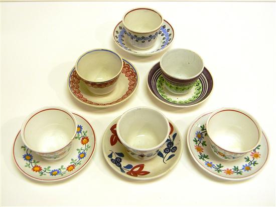 Appraisal: Geometric and floral spatterware six handleless cups and six saucers