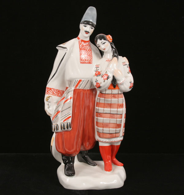 Appraisal: Russian porcelain costumed couple figure group on base young man