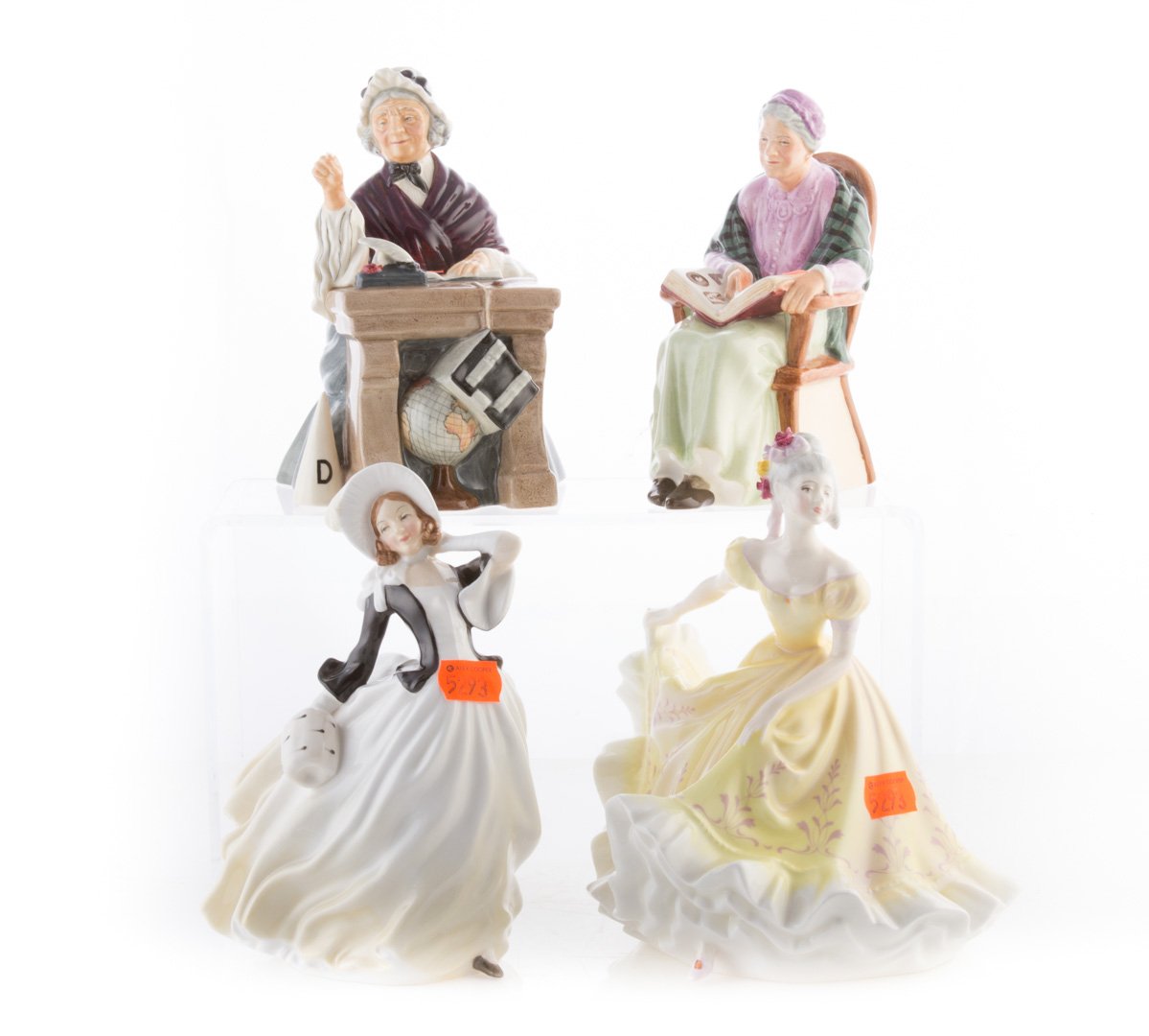 Appraisal: Four Royal Doulton china figures including The Family Album Schoolmarm