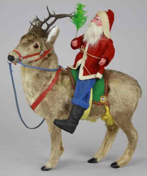 Appraisal: WONDERFUL GERMAN REINDEER WITH SANTA Germany composition and wire Santa