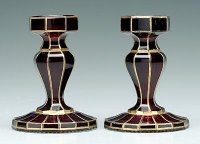 Appraisal: Pair ruby flashed glass candlesticks paneled with gilt highlights in