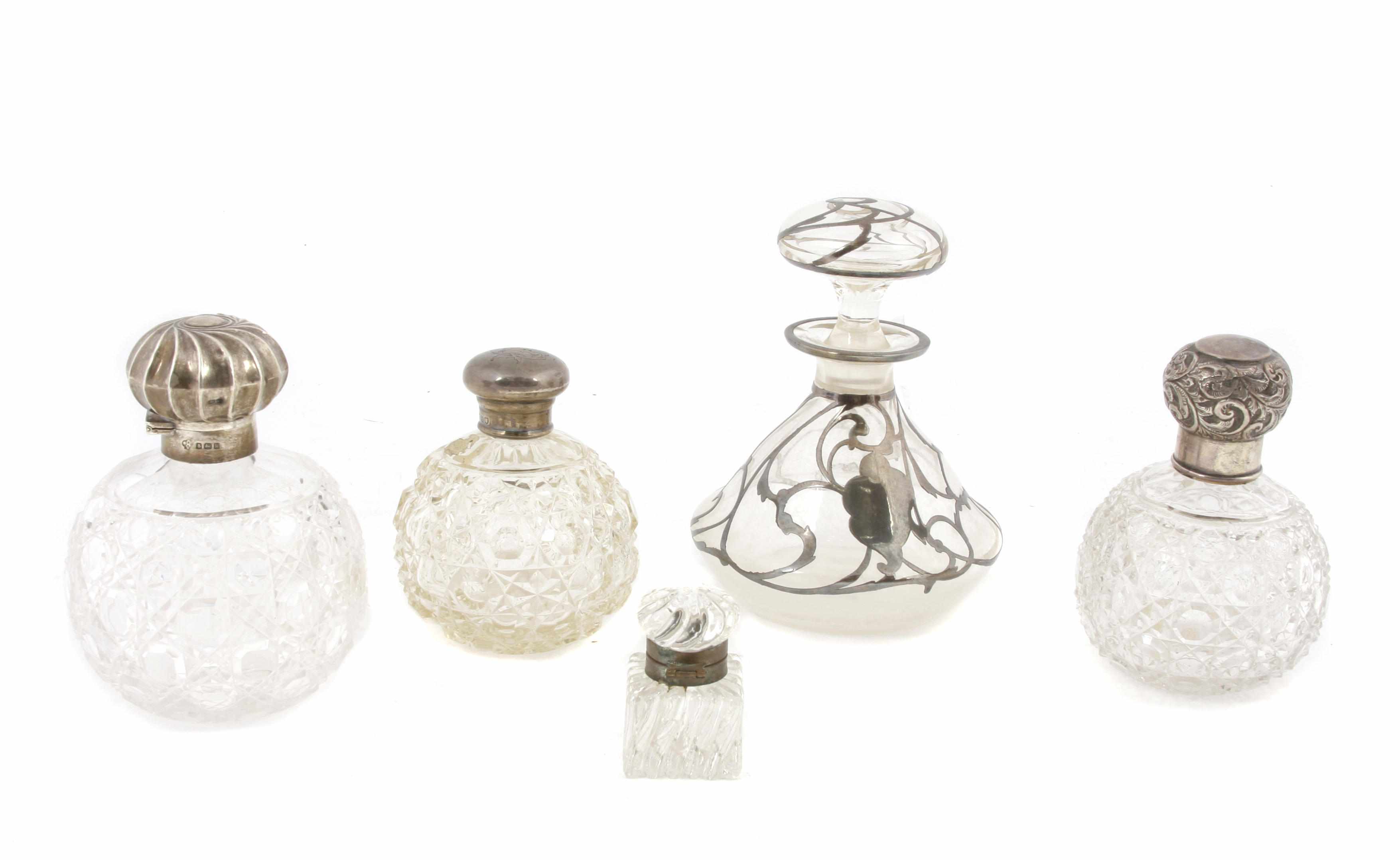 Appraisal: A group of nine silver and metal mounted glass scent