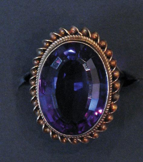 Appraisal: AN AMETHYST DRESS RING the central oval cushion-cut amethyst of