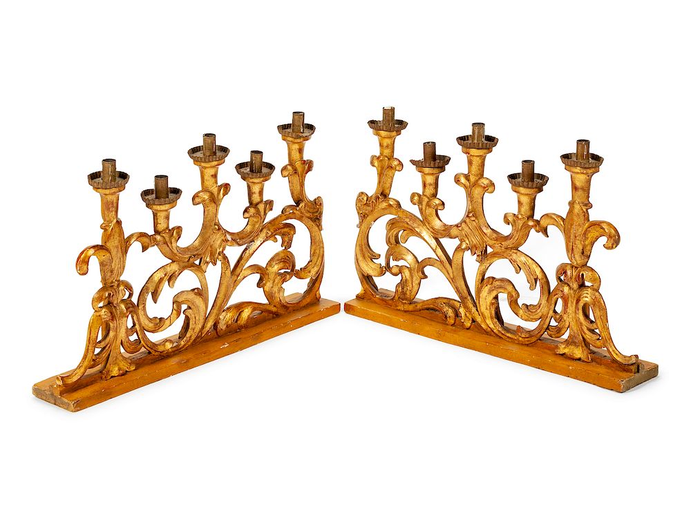 Appraisal: A Pair of Italian Rococo Style Giltwood Candelabra A Pair