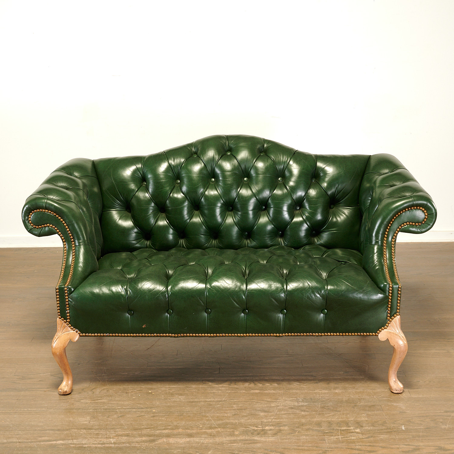 Appraisal: HANCOCK MOORE GREEN LEATHER CAMELBACK SETTEE th c American button