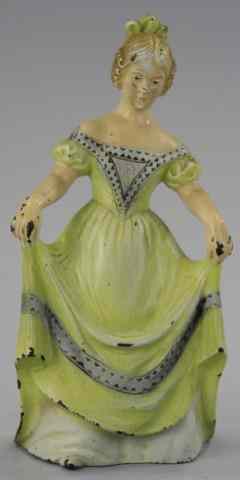 Appraisal: WOMAN WITH CURTSY DOORSTOP cJo cast iron example depicts woman