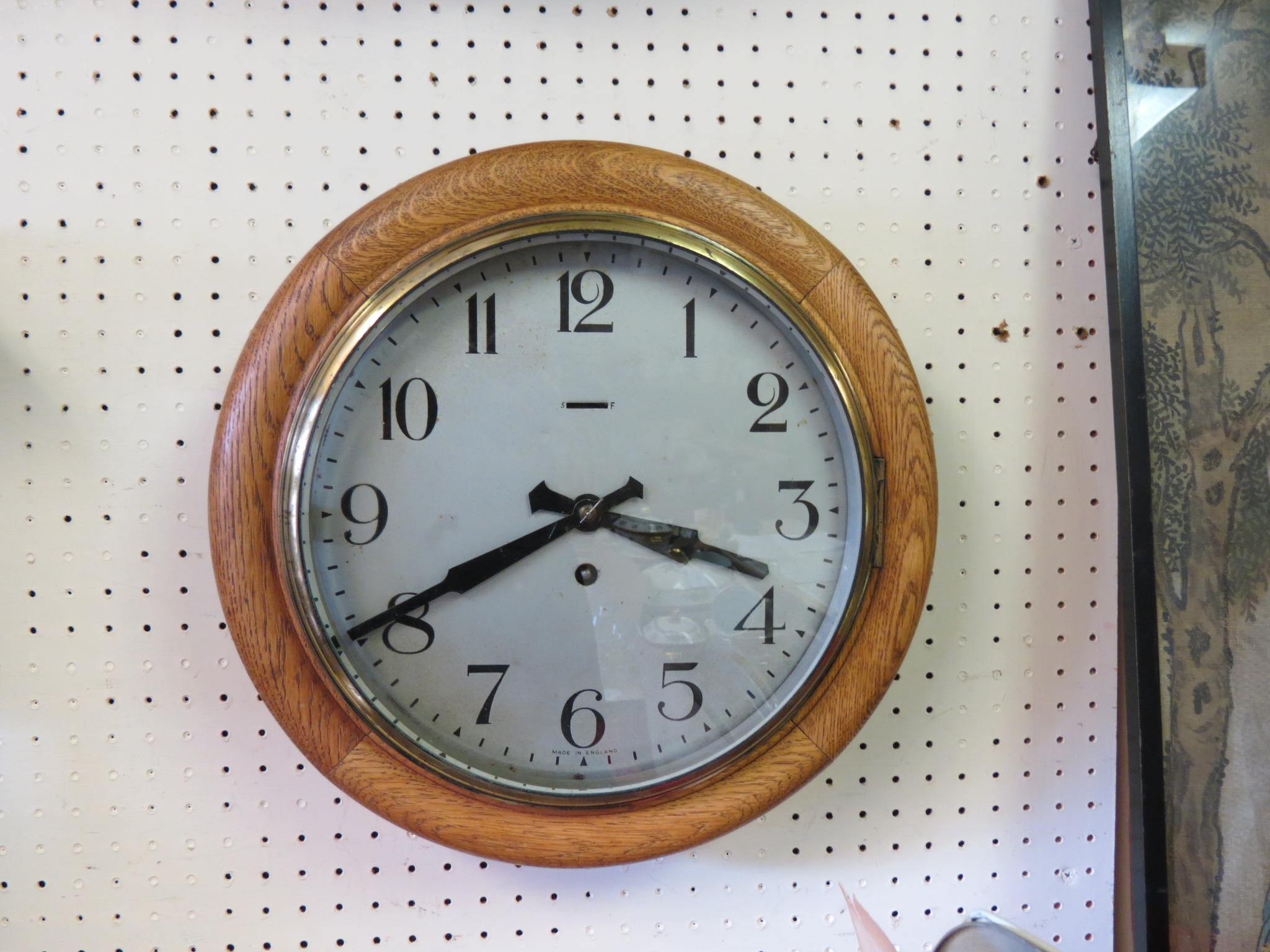 Appraisal: A Victorian dial clock in silvered dial and oak surround