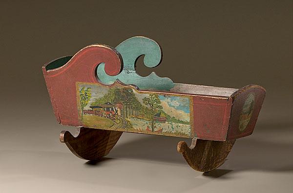 Appraisal: DOLL CRADLE DECORATED WITH TRAIN AND LANDSCAPE SCENES American mid-