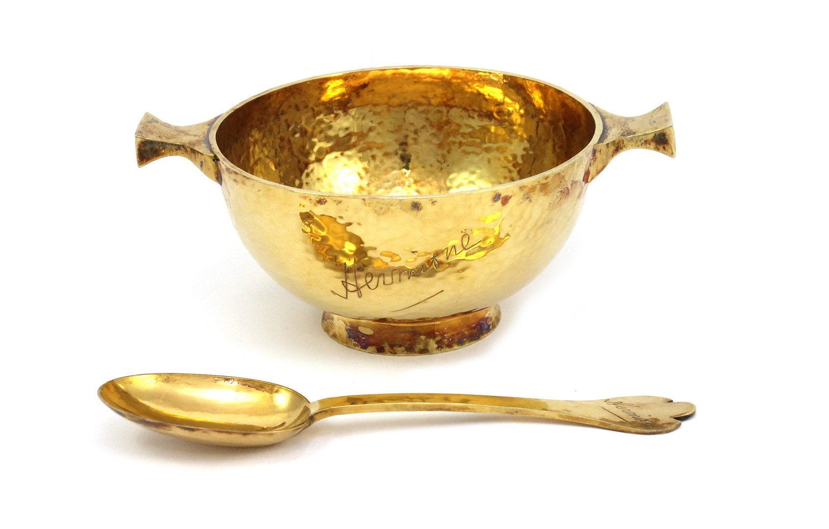 Appraisal: A silver gilt twin handled circular quaich with martele decoration