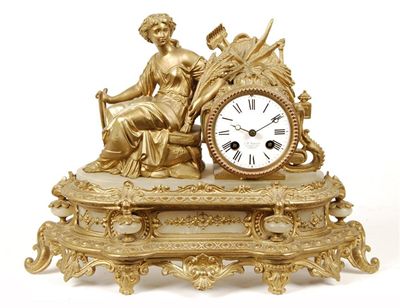 Appraisal: A gilt spelter and alabaster mantel clock with an day