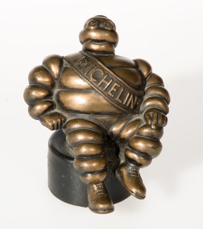 Appraisal: MICHELIN LE BIBENDUM BRONZE MASCOT the base marked Saluki Bronze