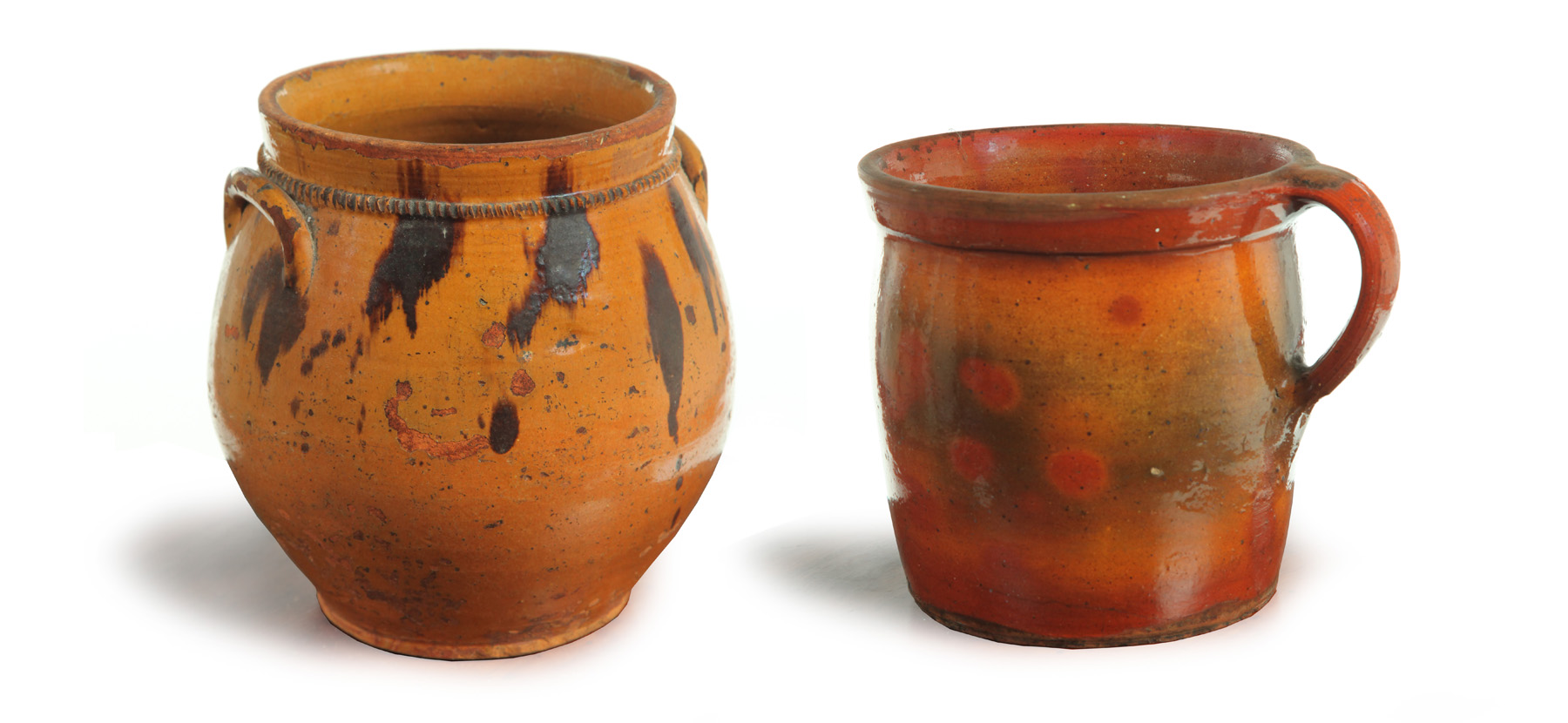 Appraisal: TWO REDWARE JARS American mid th century Ovoid with manganese