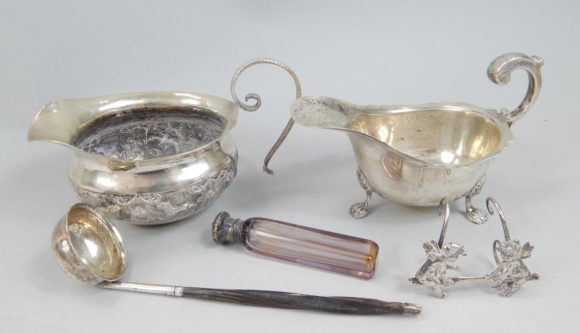 Appraisal: A George VI silver sauce boat 'S' scroll handle and