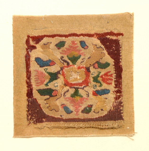 Appraisal: A SQUARE FRAGMENT decorated a repeating foliate motif in polychrome