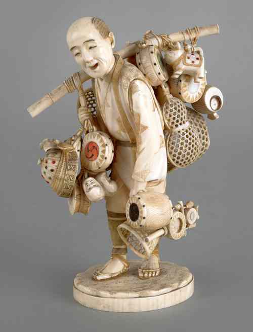 Appraisal: Japanese carved ivory figure of a peddler ca h