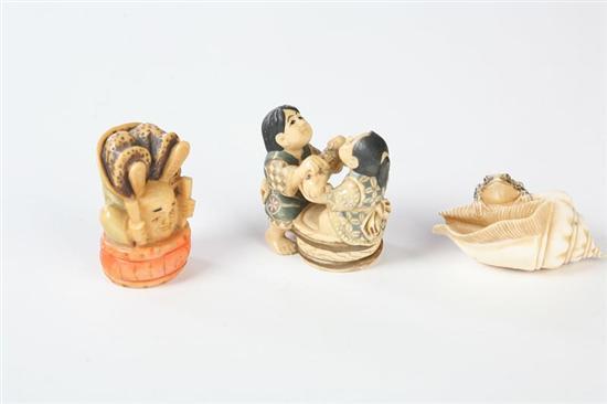 Appraisal: THREE NETSUKES Japanese th century ivory Frog with conch shell