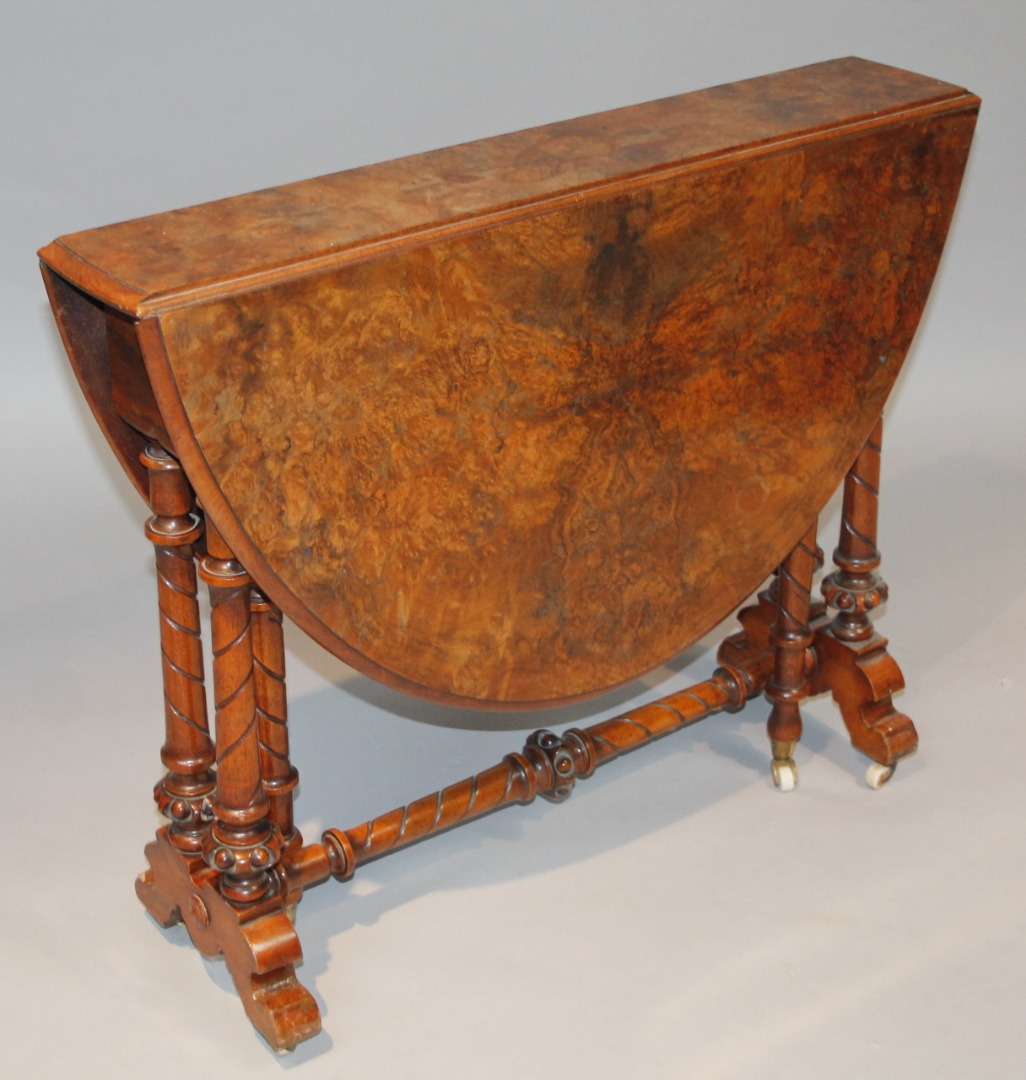 Appraisal: A late thC burr walnut gateleg Sutherland table the moulded