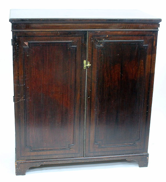 Appraisal: A TH CENTURY MAHOGANY LINEN PRESS the two panelled doors