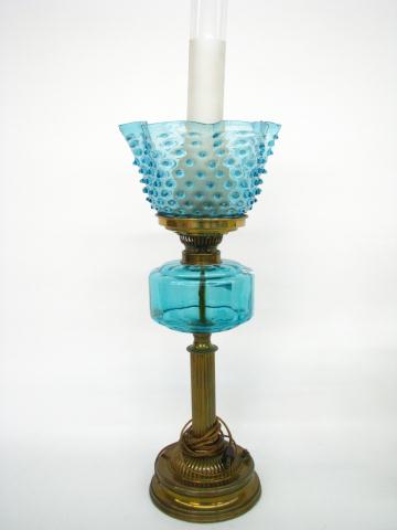 Appraisal: Cast Metal and colored glass table lamp converted from oil