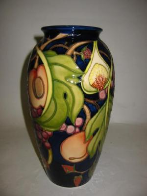 Appraisal: A MOORCROFT POTTERY VASE of slender baluster form tube lined